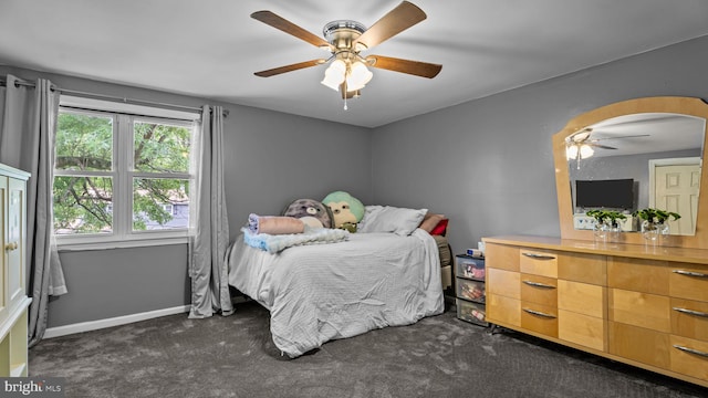 141 N Woodbine Ave, Langhorne, PA 19047 - bedroom with dark carpet, arched walkways, a ceiling fan, and baseboards