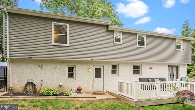 141 N Woodbine Ave, Langhorne, PA 19047 - rear view of house with a deck and stucco siding