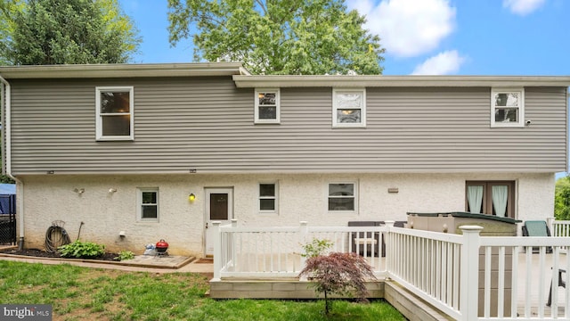 141 N Woodbine Ave, Langhorne, PA 19047 - back of property with stucco siding and a wooden deck