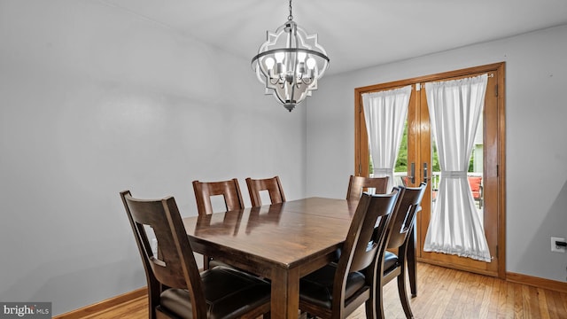 141 N Woodbine Ave, Langhorne, PA 19047 - dining area featuring a chandelier, baseboards, and light wood-type flooring