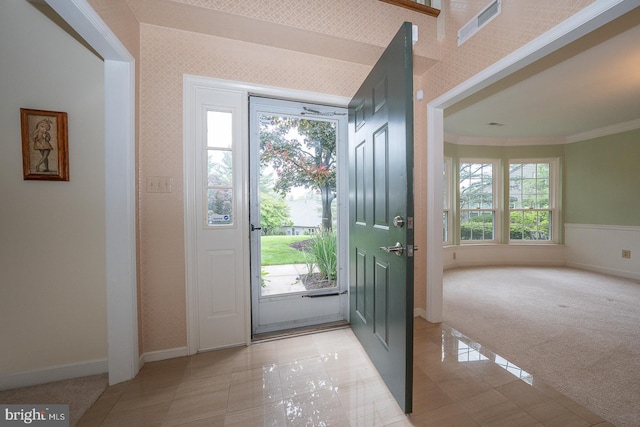 27 Manchester Ct Unit 27, Berwyn, PA 19312 - foyer entrance featuring ornamental molding, baseboards, light tile patterned floors, and light carpet