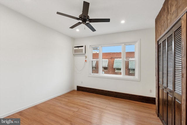 1142 Tree St, Philadelphia, PA 19148 - unfurnished bedroom featuring light wood-style flooring, recessed lighting, baseboards, a closet, and a wall unit AC