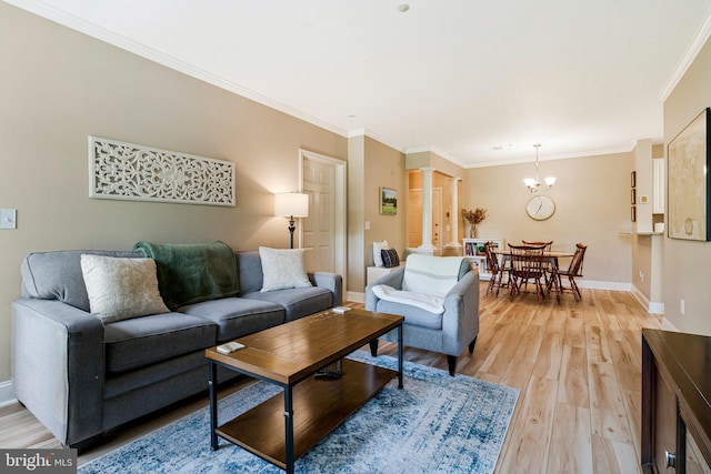7000 Falls Reach Dr Unit 307, Falls Church, VA 22043 - living room featuring a chandelier, ornate columns, light wood-style flooring, baseboards, and ornamental molding