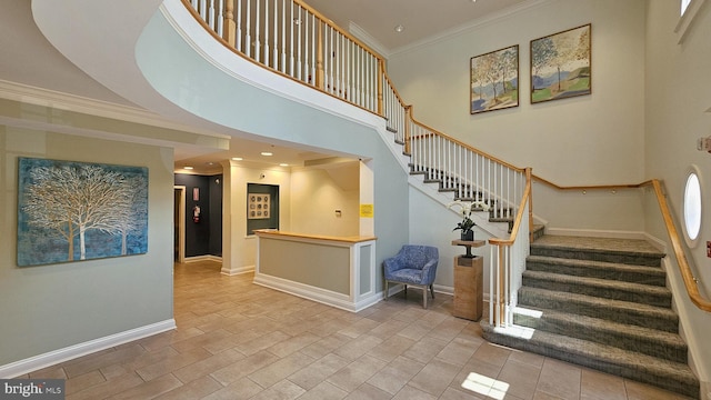 7000 Falls Reach Dr Unit 307, Falls Church, VA 22043 - stairway featuring ornamental molding, baseboards, and a towering ceiling