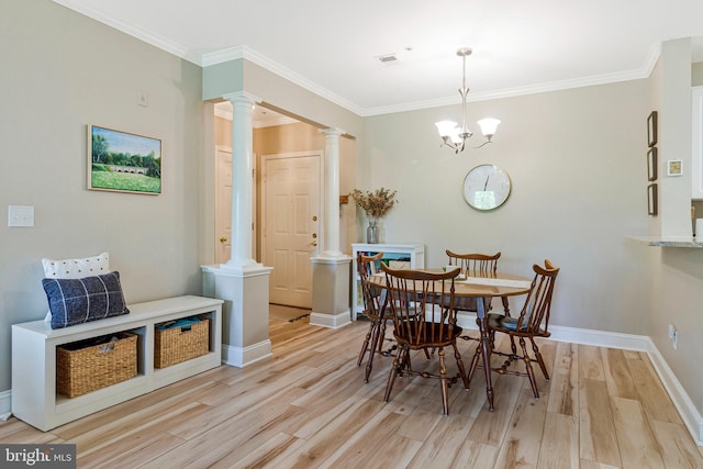 7000 Falls Reach Dr Unit 307, Falls Church, VA 22043 - dining space featuring ornate columns, light wood-style floors, crown molding, baseboards, and a chandelier