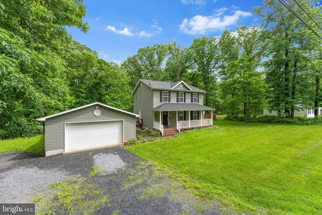 308 Fawn Dr, Winchester, VA 22602 - view of front of house with covered porch, an outdoor structure, a detached garage, a front lawn, and view of wooded area