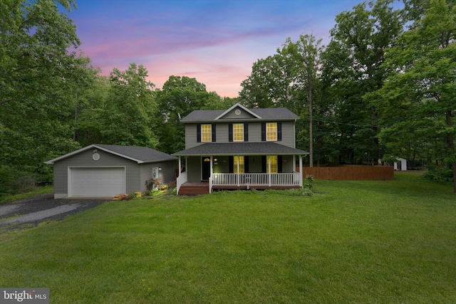 308 Fawn Dr, Winchester, VA 22602 - view of front of home with covered porch, an outdoor structure, a detached garage, a front lawn, and a shingled roof