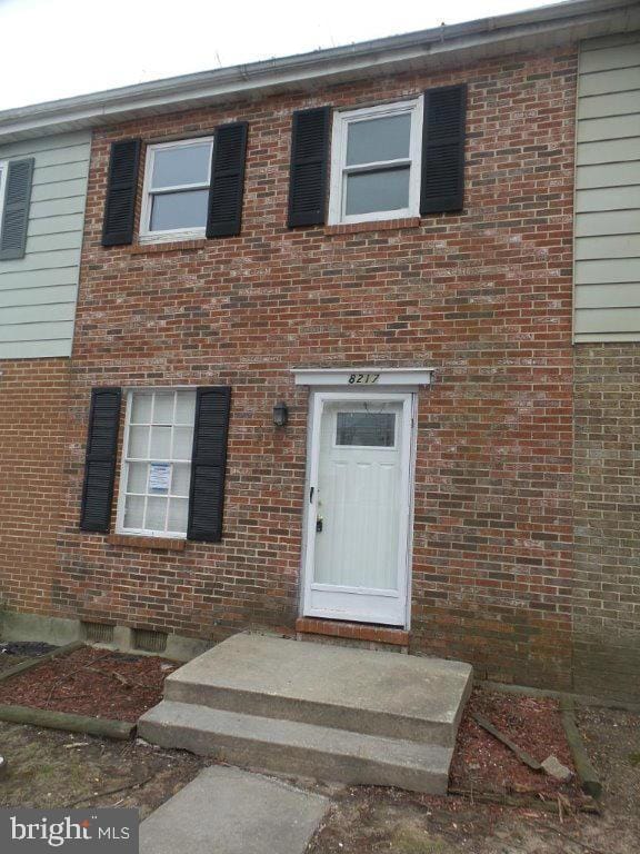 view of front of house featuring brick siding