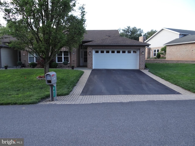 947 Geyer Dr, Chambersburg, PA 17201 - ranch-style home featuring brick siding, an attached garage, asphalt driveway, and a front yard