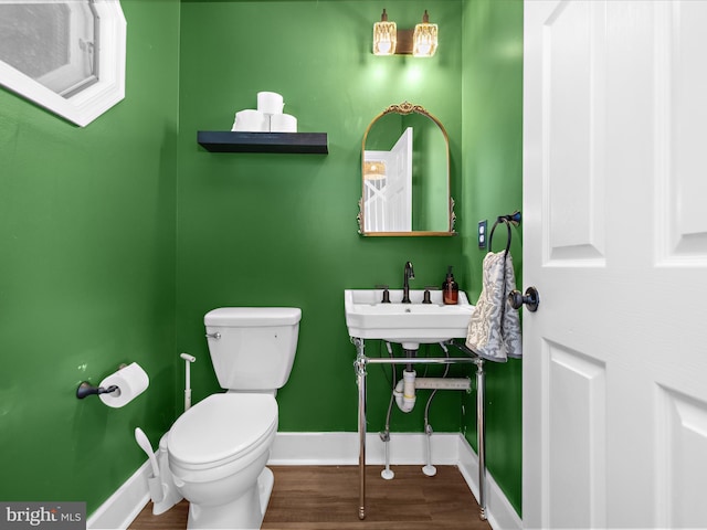 7827 Catherine Ave, Pasadena, MD 21122 - bathroom with wood finished floors and toilet