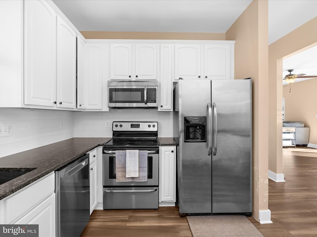 7827 Catherine Ave, Pasadena, MD 21122 - kitchen with appliances with stainless steel finishes, white cabinetry, and dark wood-style floors