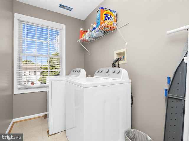7827 Catherine Ave, Pasadena, MD 21122 - washroom with independent washer and dryer and light tile patterned floors