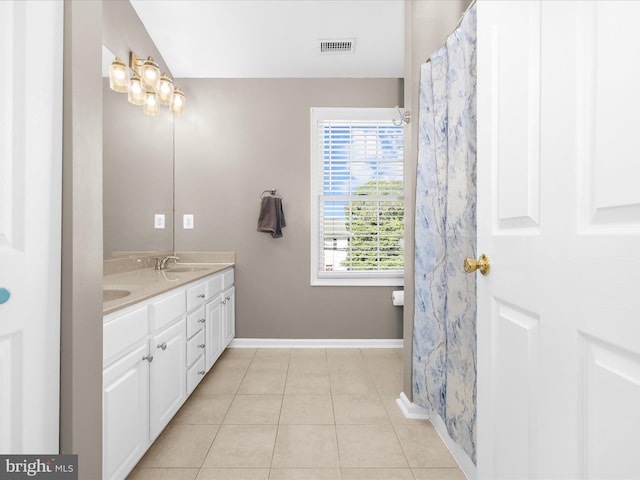 7827 Catherine Ave, Pasadena, MD 21122 - full bath with double vanity and tile patterned flooring
