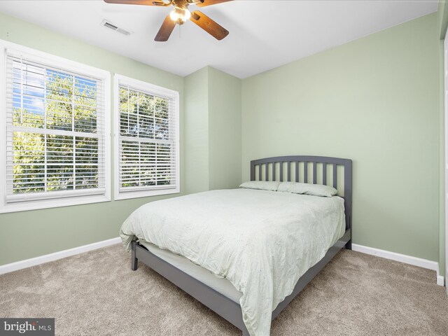 7827 Catherine Ave, Pasadena, MD 21122 - carpeted bedroom with baseboards and ceiling fan