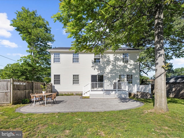 7827 Catherine Ave, Pasadena, MD 21122 - rear view of house with a patio area and a deck