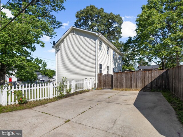 7827 Catherine Ave, Pasadena, MD 21122 - view of home's exterior with a patio area