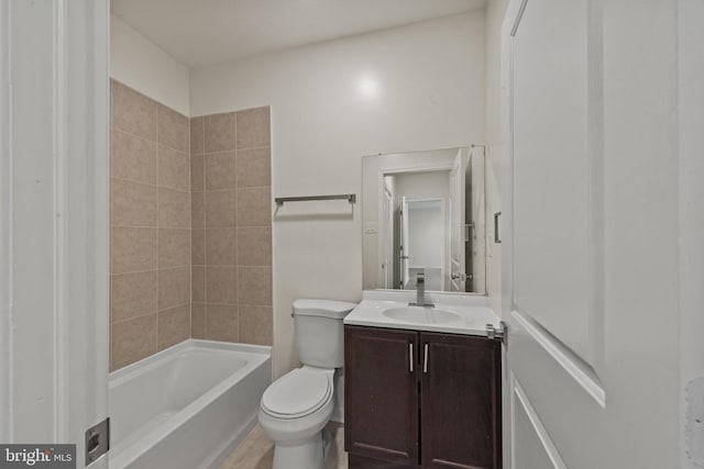 bathroom with toilet, vanity, and bathing tub / shower combination