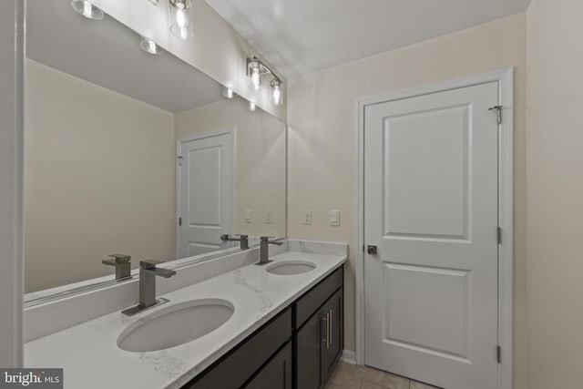 full bathroom with double vanity and tile patterned floors