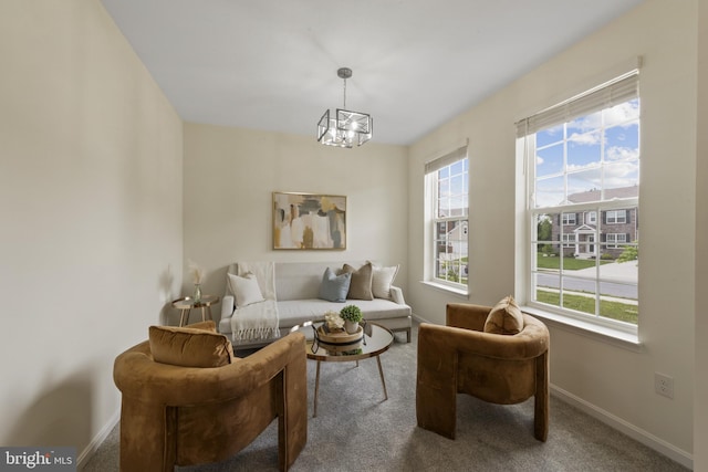 living area with carpet floors, baseboards, and plenty of natural light