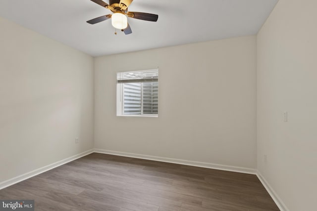 spare room with wood finished floors, baseboards, and ceiling fan
