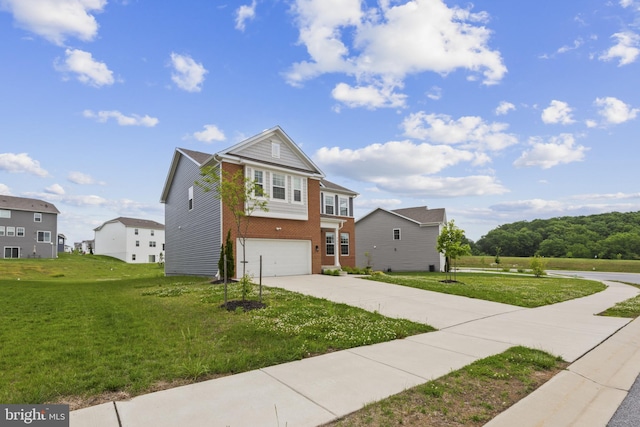 traditional home with brick siding, driveway, an attached garage, and a front lawn