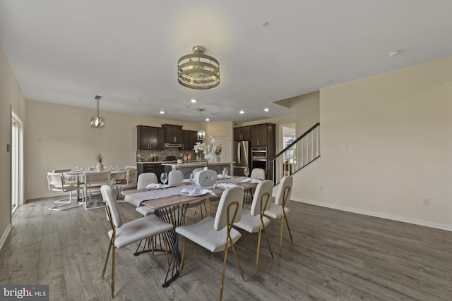 dining area featuring baseboards, dark wood-style floors, recessed lighting, and stairs