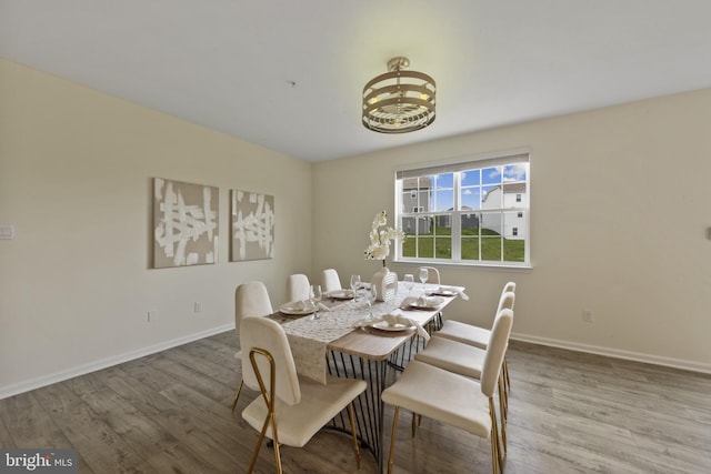 dining room with wood finished floors and baseboards