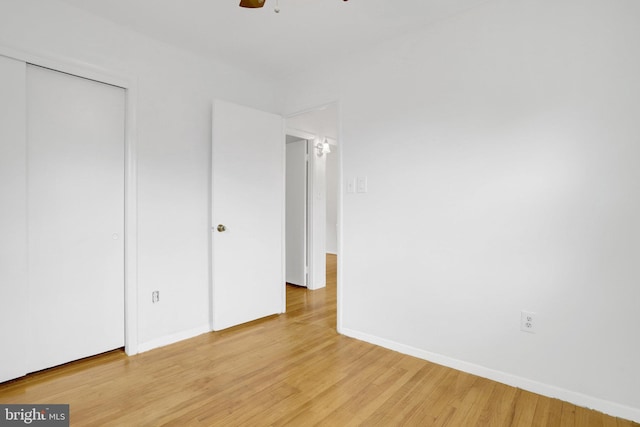 1501 Stirling Ct, Fort Washington, MD 20744 - unfurnished bedroom featuring light wood finished floors, baseboards, a closet, and a ceiling fan