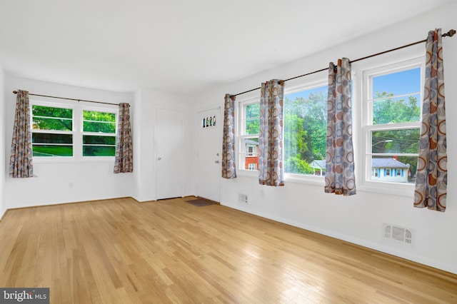 1501 Stirling Ct, Fort Washington, MD 20744 - unfurnished room featuring light wood-type flooring, plenty of natural light, and baseboards