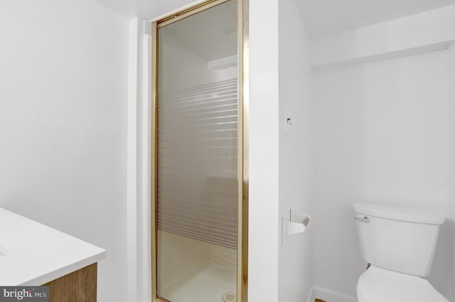 1501 Stirling Ct, Fort Washington, MD 20744 - bathroom with vanity, toilet, a stall shower, and baseboards
