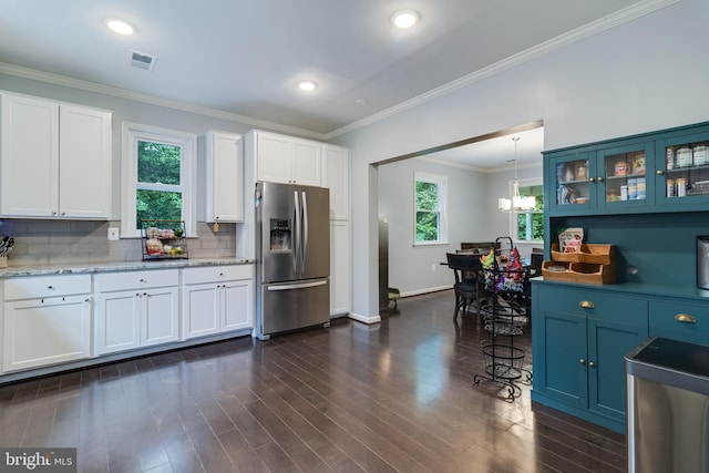 10560 S Faulkner Rd, Faulkner, MD 20632 - kitchen with stainless steel refrigerator with ice dispenser, plenty of natural light, glass insert cabinets, white cabinets, and crown molding