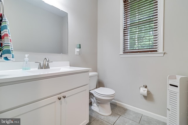 10560 S Faulkner Rd, Faulkner, MD 20632 - bathroom featuring toilet, vanity, tile patterned floors, and baseboards