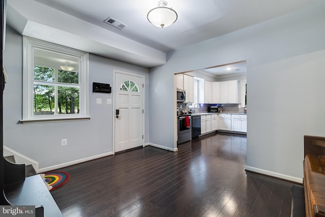 10560 S Faulkner Rd, Faulkner, MD 20632 - entrance foyer featuring baseboards and dark wood-type flooring