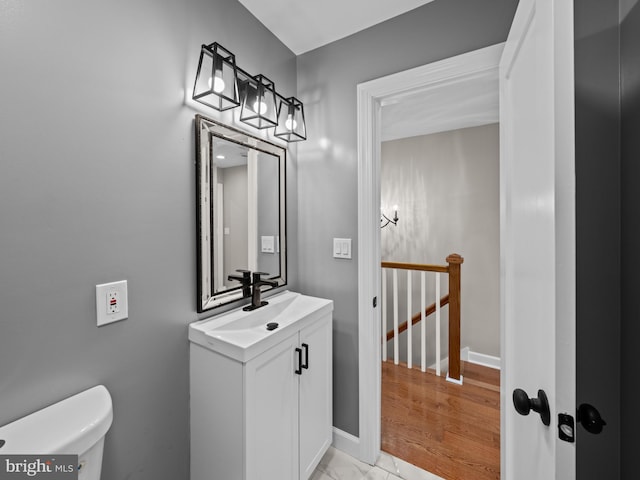 519 23rd Pl NE, Washington, DC 20002 - bathroom featuring vanity, toilet, and baseboards
