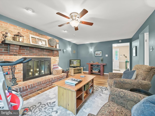 5264 Open Window, Columbia, MD 21044 - living room with wood finished floors, ceiling fan, and a fireplace