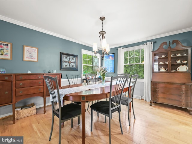 5264 Open Window, Columbia, MD 21044 - dining space with ornamental molding, a chandelier, plenty of natural light, and light wood-type flooring