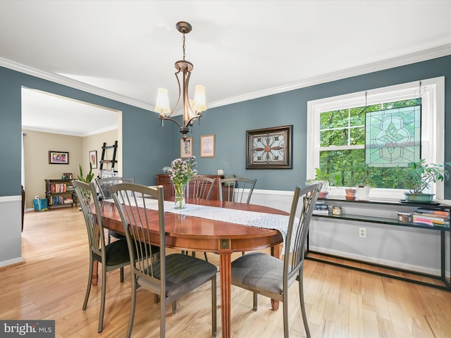 5264 Open Window, Columbia, MD 21044 - dining area featuring ornamental molding, a chandelier, and light wood-type flooring