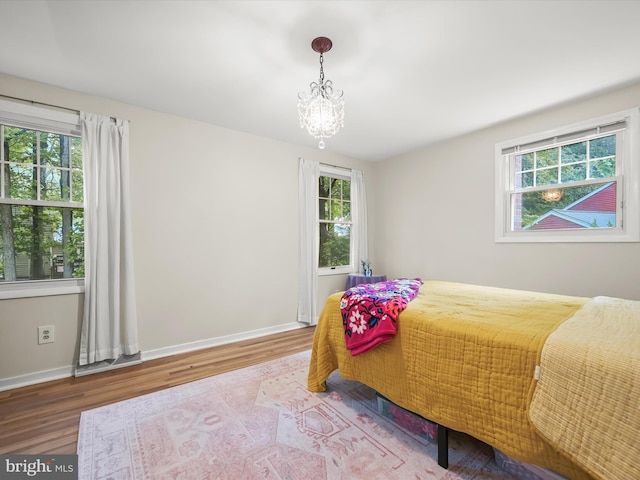 5264 Open Window, Columbia, MD 21044 - bedroom featuring wood finished floors and a chandelier
