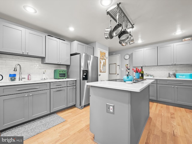 5264 Open Window, Columbia, MD 21044 - kitchen featuring stainless steel fridge, gray cabinetry, black electric cooktop, decorative backsplash, and recessed lighting