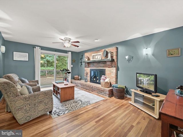 5264 Open Window, Columbia, MD 21044 - living area with wood finished floors, a fireplace, and a ceiling fan