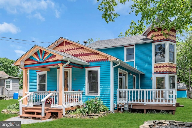 19 Center St, Barnegat, NJ 08005 - view of front facade featuring a porch, a front yard, and a shingled roof