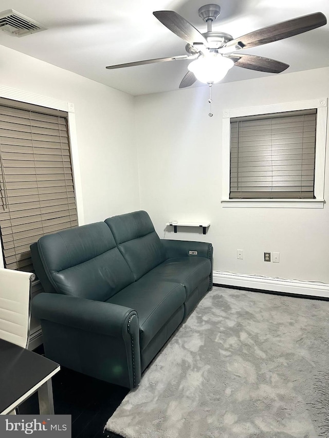 19 Center St, Barnegat, NJ 08005 - living area with a baseboard radiator, carpet floors, and ceiling fan