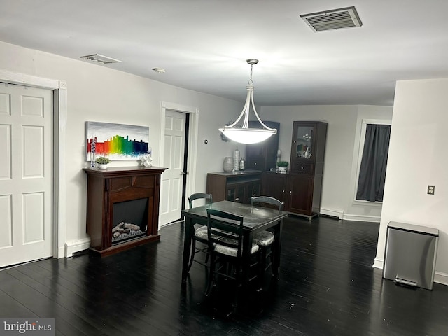19 Center St, Barnegat, NJ 08005 - dining area featuring wood finished floors, baseboards, and a fireplace