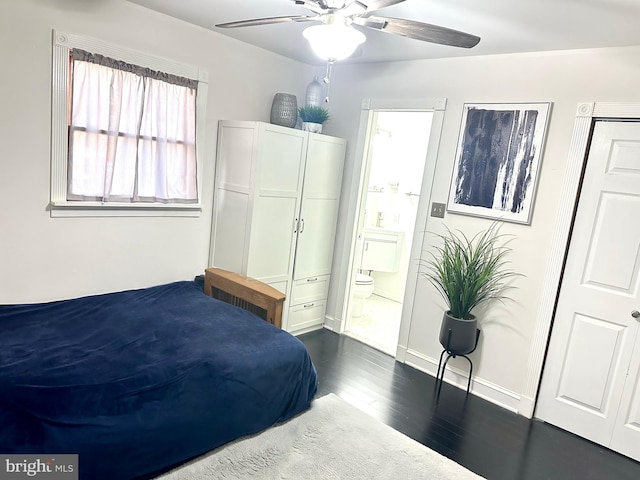 19 Center St, Barnegat, NJ 08005 - bedroom with dark wood-style flooring, ensuite bath, baseboards, and ceiling fan