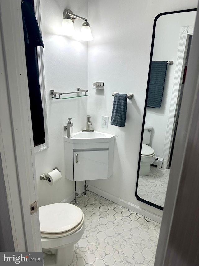 19 Center St, Barnegat, NJ 08005 - half bath featuring toilet, a sink, baseboard heating, and baseboards