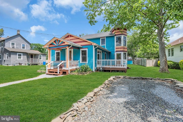 19 Center St, Barnegat, NJ 08005 - victorian house with a front yard and covered porch