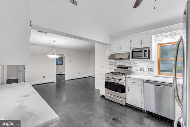 19 Center St, Barnegat, NJ 08005 - kitchen featuring stainless steel appliances, under cabinet range hood, light countertops, decorative backsplash, and white cabinetry