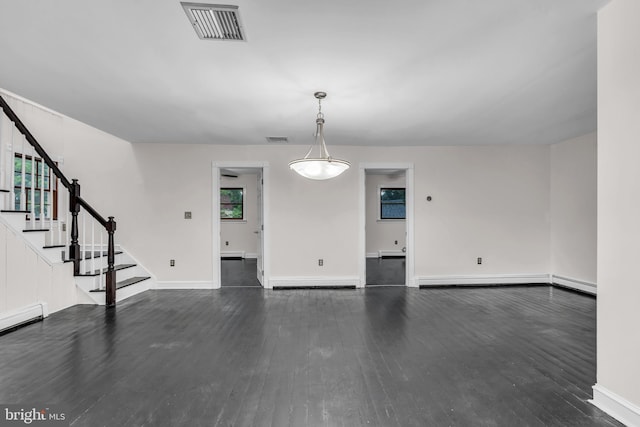 19 Center St, Barnegat, NJ 08005 - unfurnished living room featuring dark wood-style flooring, stairway, baseboard heating, and baseboards
