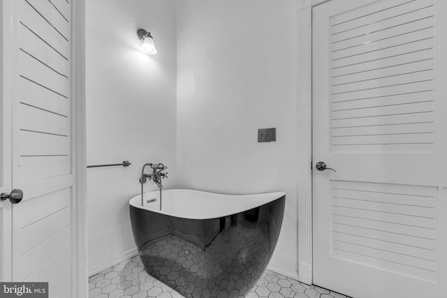 19 Center St, Barnegat, NJ 08005 - bathroom with baseboards, pet washing area, a freestanding tub, and tile patterned flooring