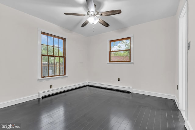 19 Center St, Barnegat, NJ 08005 - empty room featuring ceiling fan, dark wood-type flooring, baseboard heating, baseboards, and a baseboard radiator